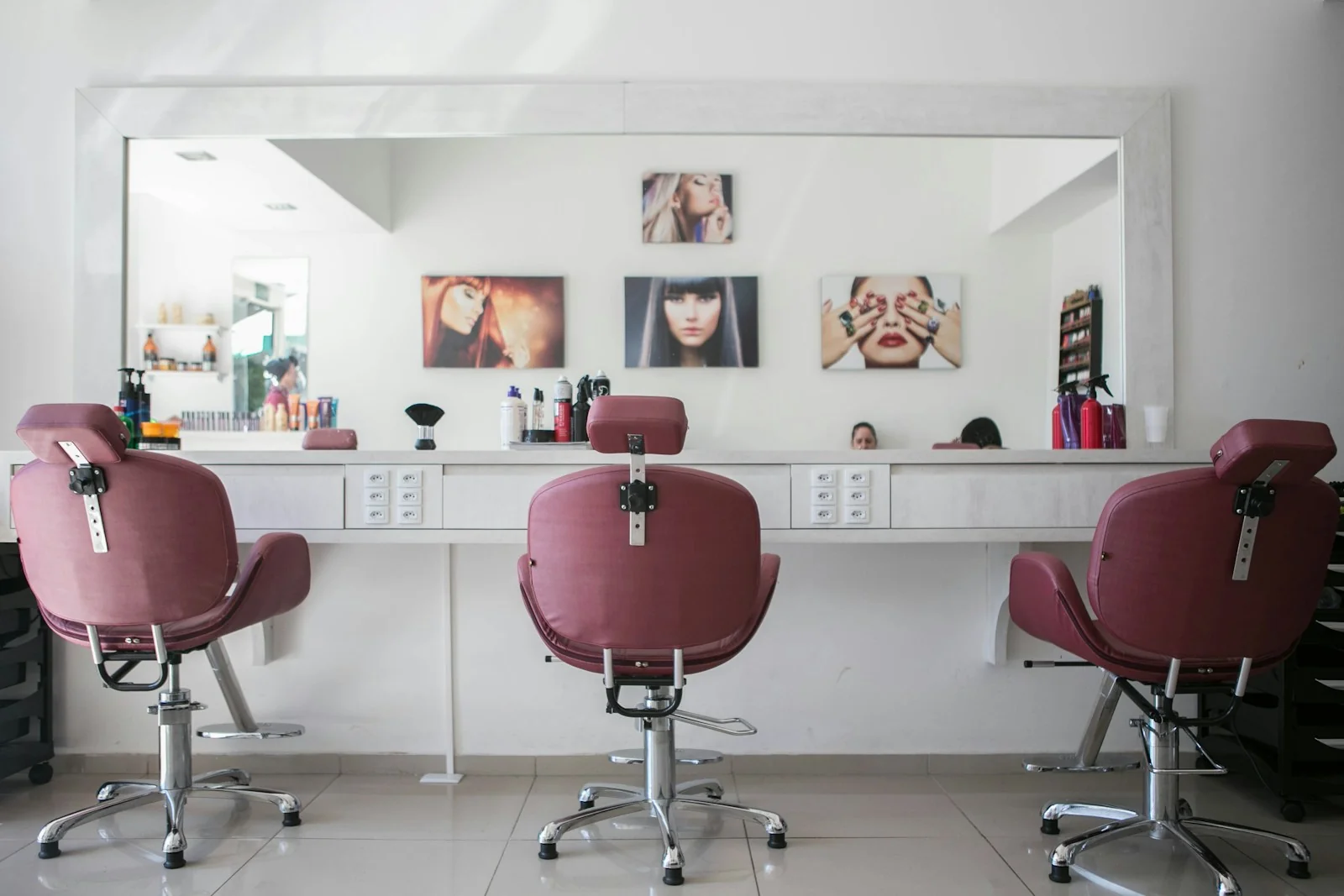 An inviting salon interior with rose-coloured chairs